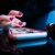 Hand hovering over a smartphone touchscreen, poised to tap